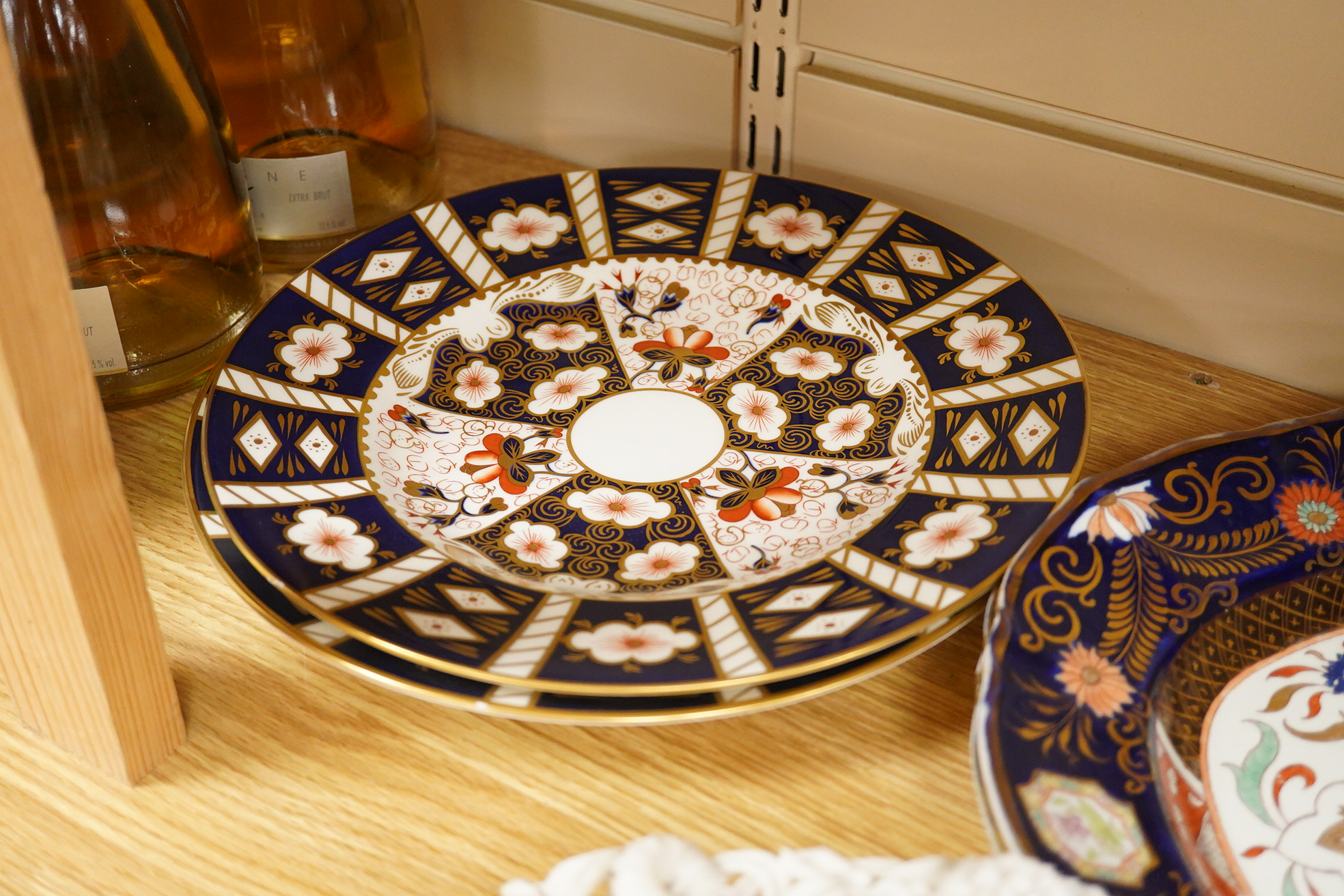 A Belleek porcelain basket, two Masons Ironstone dishes, a pair of Royal Crown Derby Japan pattern dishes and an ironstone leaf shaped dish (6).